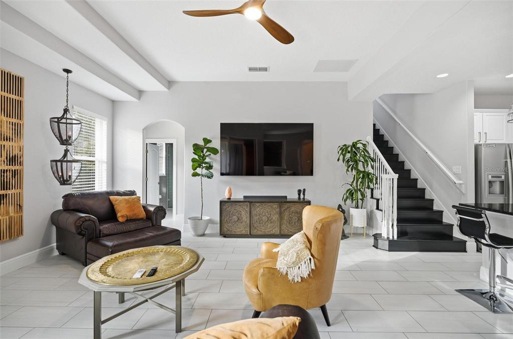 2914 Lee Shore Loop Orlando, FL 32820 - Photo 42 of 96 a living room with furniture a flat screen tv and a fireplace