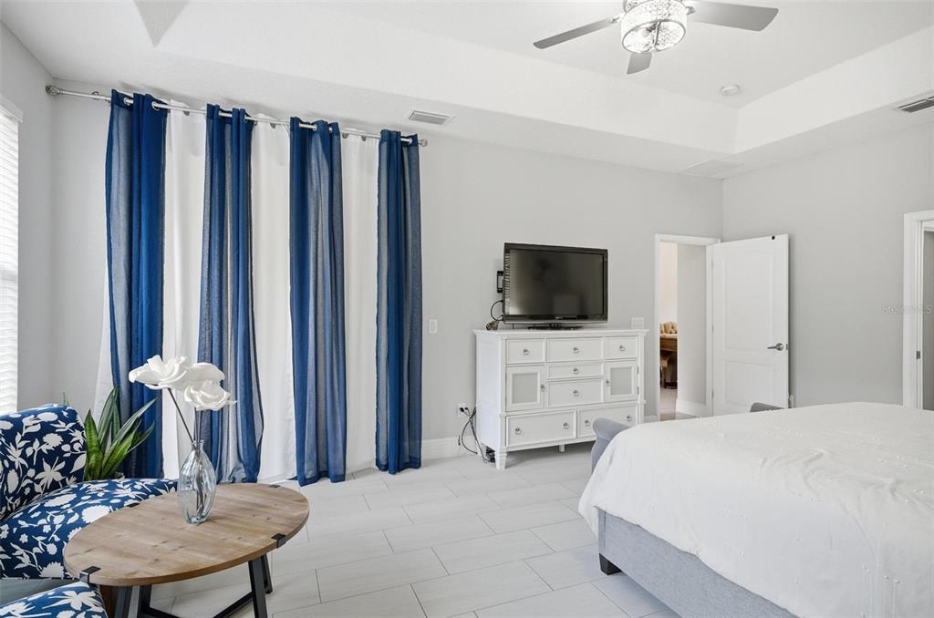 2914 Lee Shore Loop Orlando, FL 32820 - Photo 49 of 96 a bed room with furniture and a flat screen tv