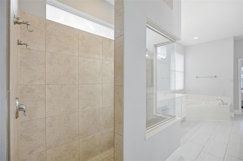 2914 Lee Shore Loop Orlando, FL 32820 - Photo 54 of 96 a bathroom with a shower and a glass door