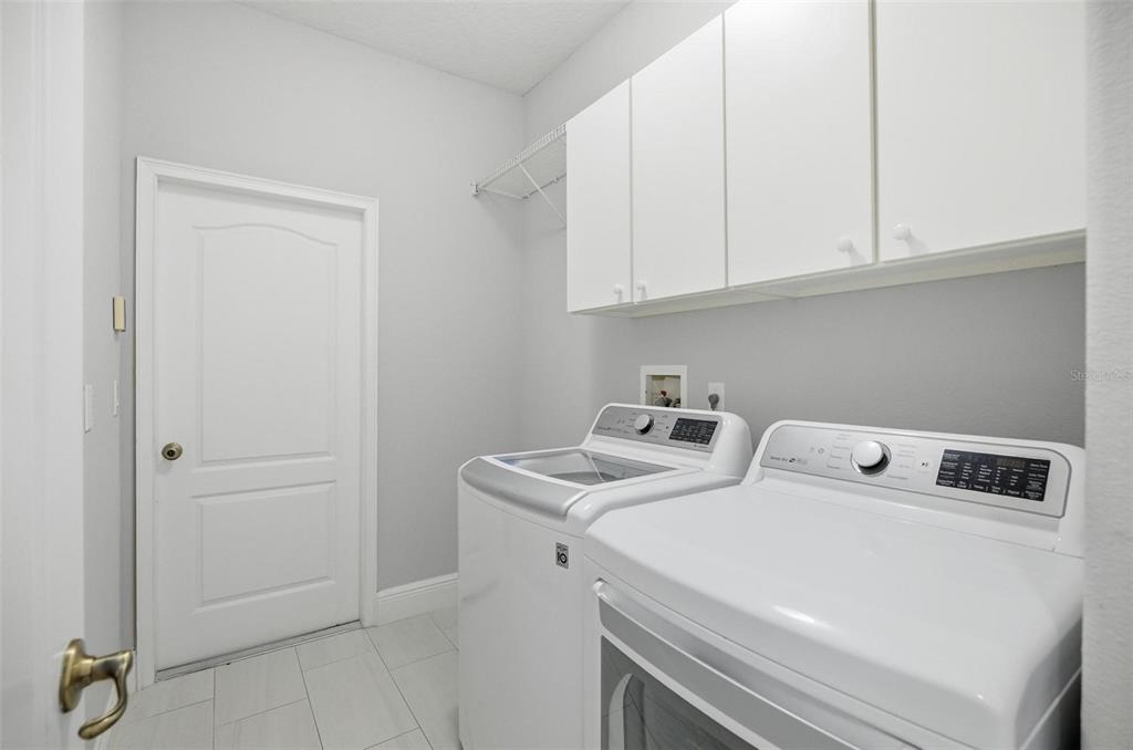2914 Lee Shore Loop Orlando, FL 32820 - Photo 58 of 96 a utility room with dryer and washer