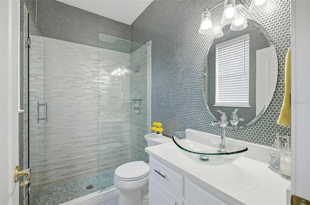 2914 Lee Shore Loop Orlando, FL 32820 - Photo 62 of 96 a bathroom with a sink a toilet a mirror and shower