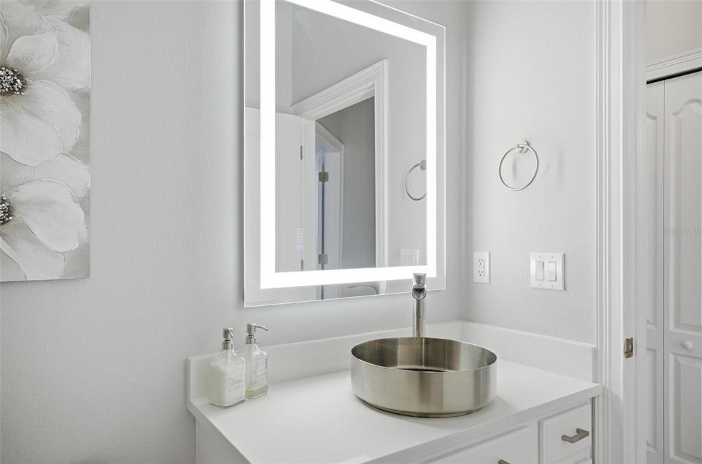 2914 Lee Shore Loop Orlando, FL 32820 - Photo 69 of 96 a bathroom with a sink and a mirror