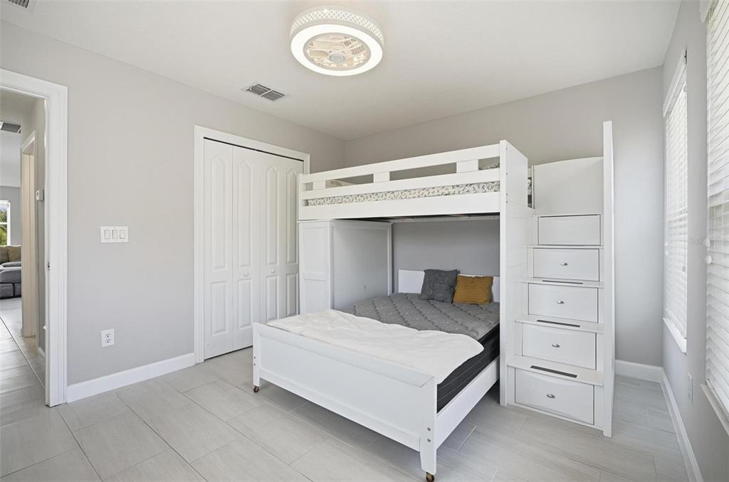 2914 Lee Shore Loop Orlando, FL 32820 - Photo 79 of 96 a bedroom with a bed and a washing machine in it