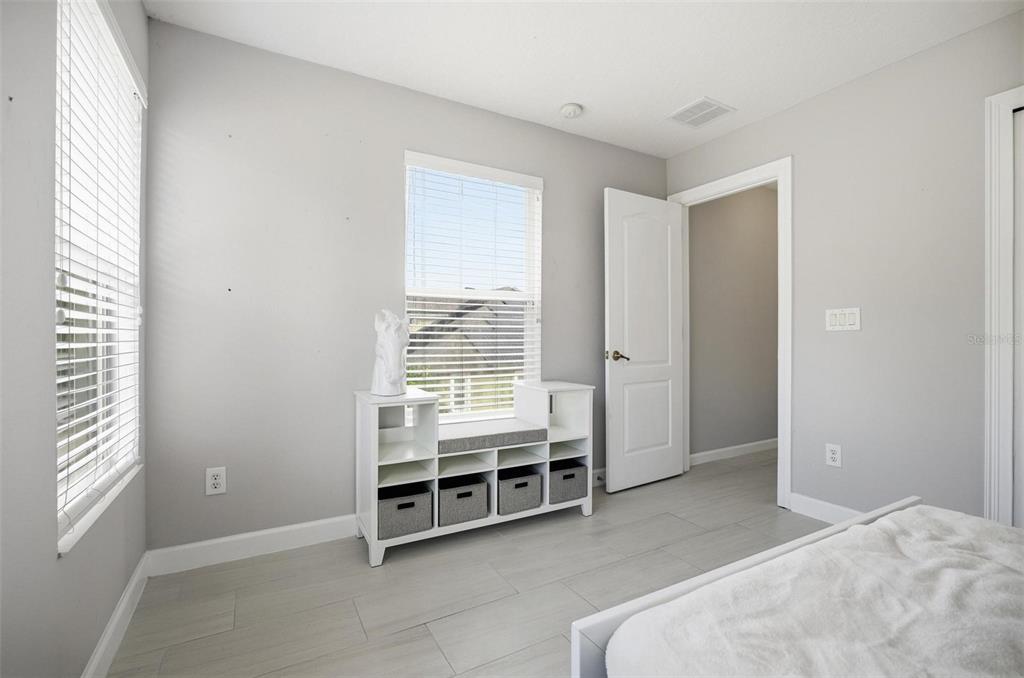 2914 Lee Shore Loop Orlando, FL 32820 - Photo 80 of 96 a view of a bedroom with furniture and window