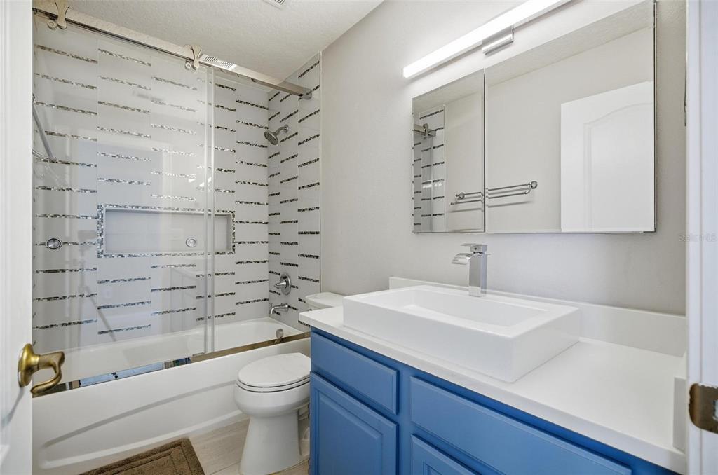 2914 Lee Shore Loop Orlando, FL 32820 - Photo 81 of 96 a bathroom with a sink a toilet and shower