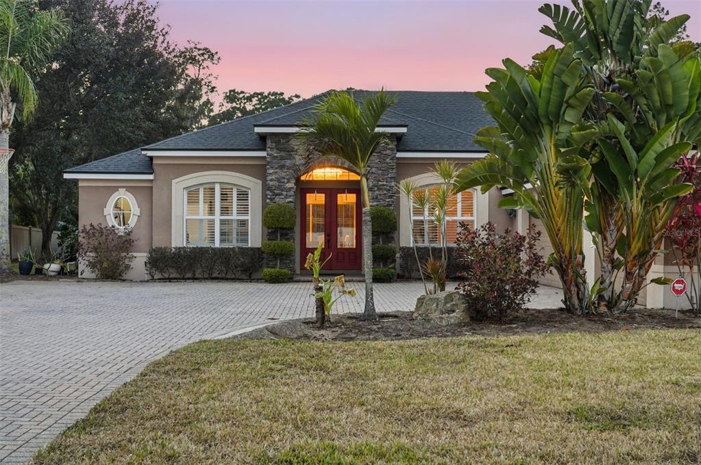 2914 Lee Shore Loop Orlando, FL 32820 - Photo 92 of 96 a front view of a house with garden
