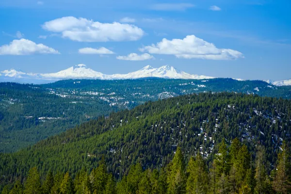 a view of a town with mountains in the background