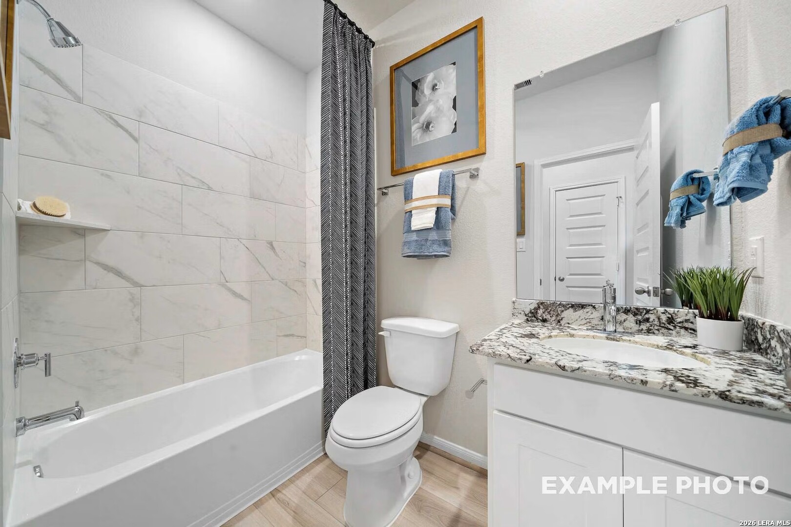 16611 Rosemary Ridge Elmendorf, TX 78112 - Photo 21 of 32 a bathroom with a granite countertop sink toilet and shower