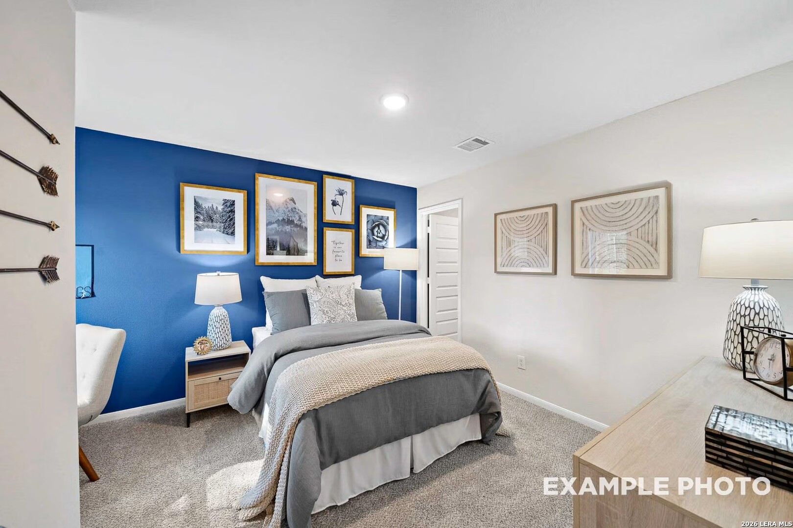 16611 Rosemary Ridge Elmendorf, TX 78112 - Photo 26 of 32 a bedroom with a large bed and a window