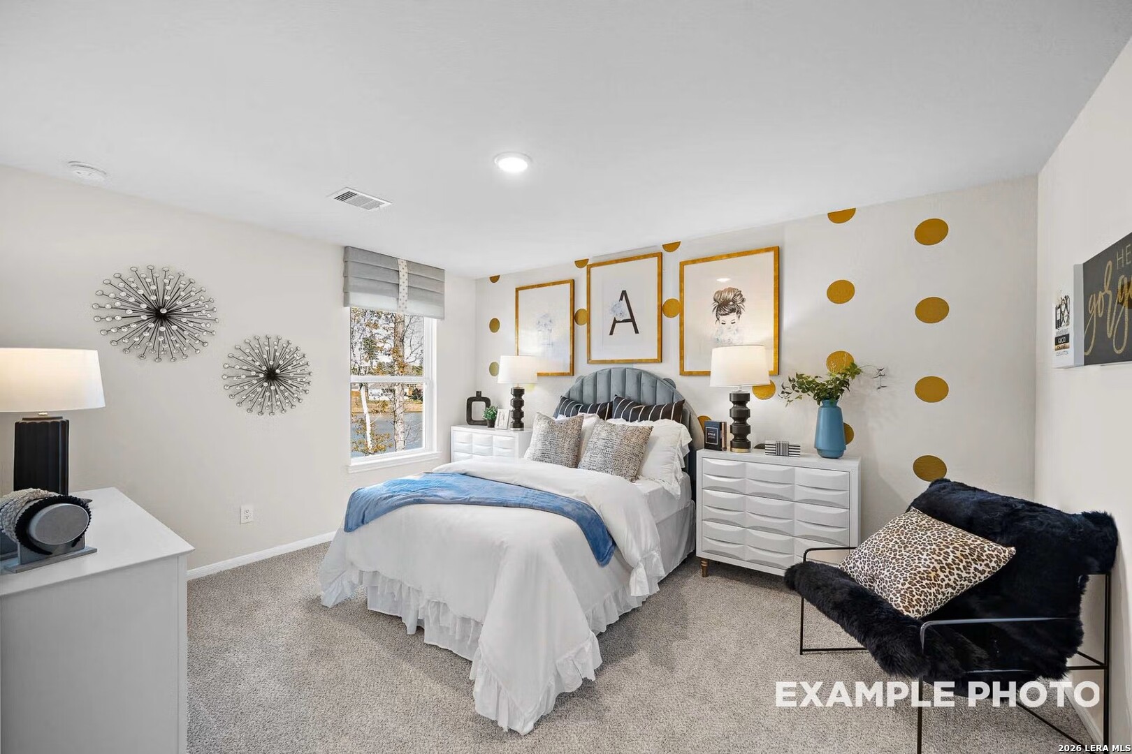 16611 Rosemary Ridge Elmendorf, TX 78112 - Photo 29 of 32 a bedroom with a bed and a couch