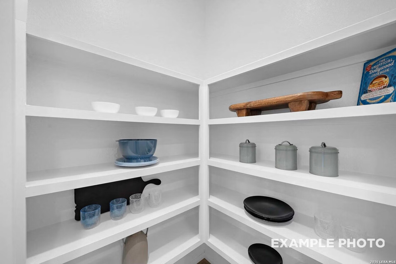 16611 Rosemary Ridge Elmendorf, TX 78112 - Photo 10 of 32 a shelf with cup and plates