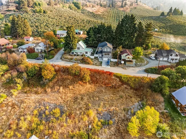 a view of swimming pool with outdoor seating and city view