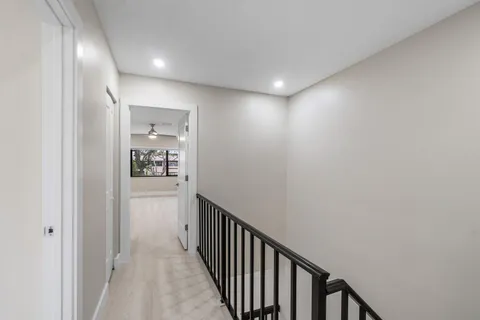 a view of walk in closet with empty racks