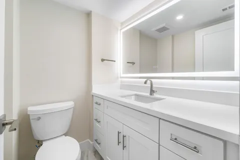 a bathroom with a toilet and shower