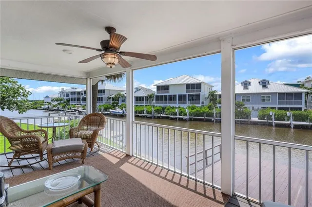 a view of swimming pool with outdoor seating