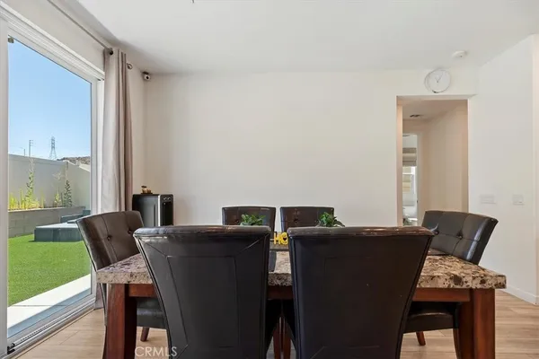 a view of a dining room with furniture and window