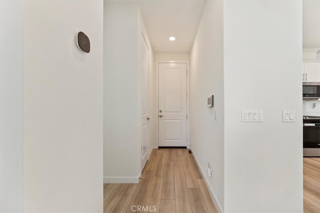 20911 Jennings Way Newhall, CA 91321 - Photo 20 of 50 a view of a hallway with wooden floor