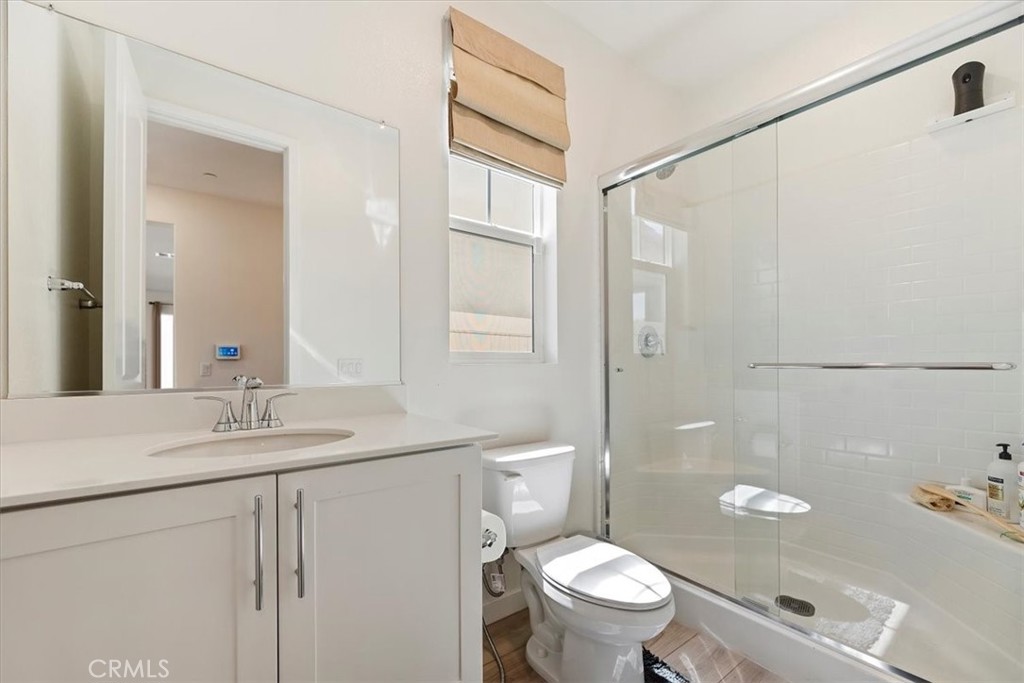 20911 Jennings Way Newhall, CA 91321 - Photo 23 of 50 a bathroom with a granite countertop sink toilet and shower