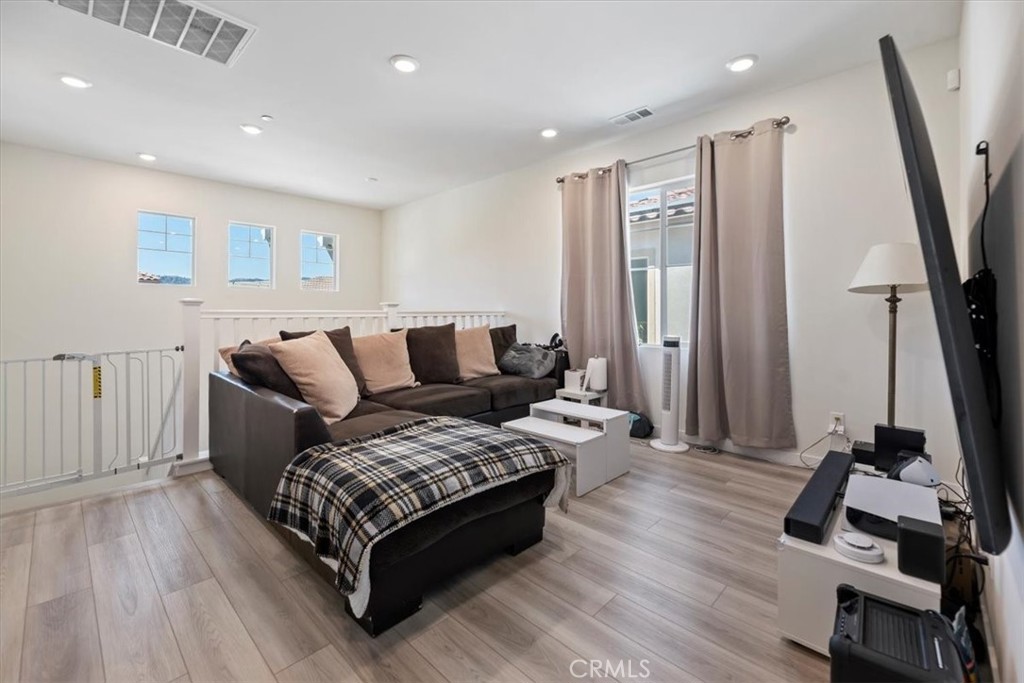 20911 Jennings Way Newhall, CA 91321 - Photo 24 of 50 a living room with furniture and a flat screen tv