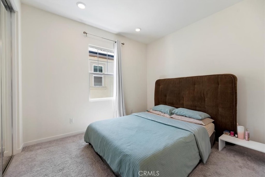 20911 Jennings Way Newhall, CA 91321 - Photo 30 of 50 a bedroom with a bed and a chair