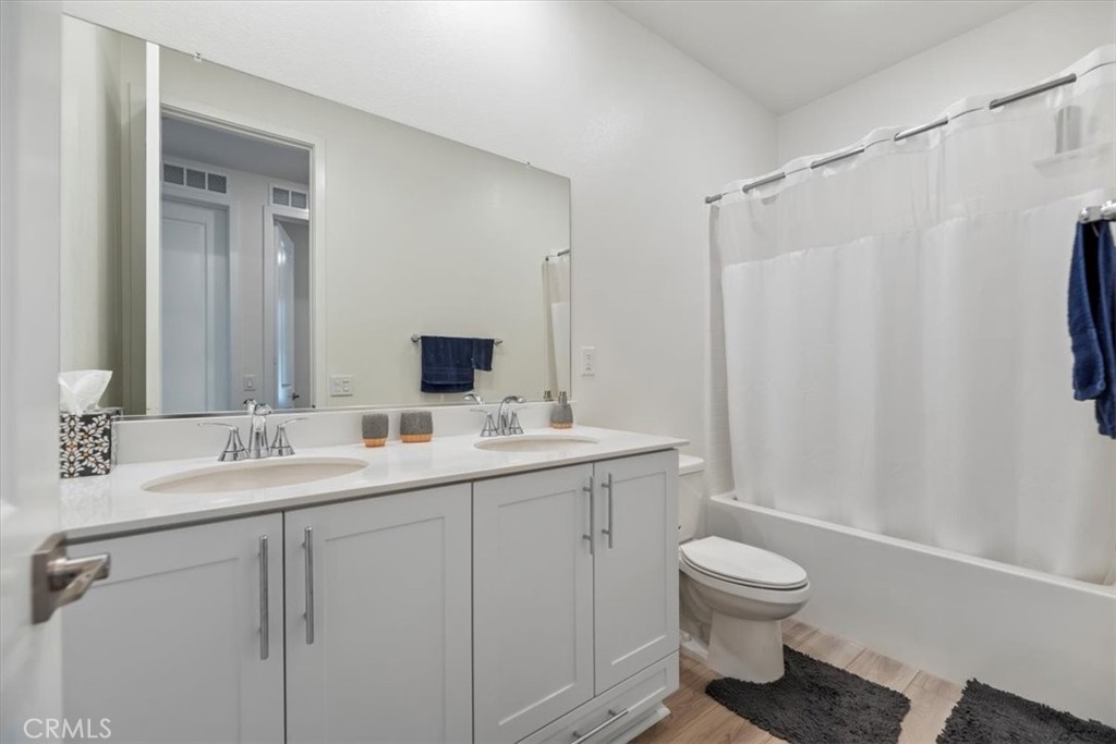 20911 Jennings Way Newhall, CA 91321 - Photo 32 of 50 a bathroom with a sink toilet and shower