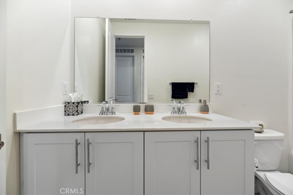 20911 Jennings Way Newhall, CA 91321 - Photo 33 of 50 a bathroom with a sink and a mirror
