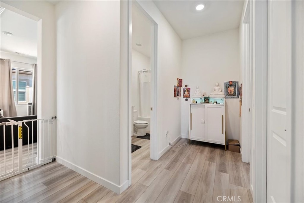 20911 Jennings Way Newhall, CA 91321 - Photo 34 of 50 a view of a hallway with wooden floor and closet