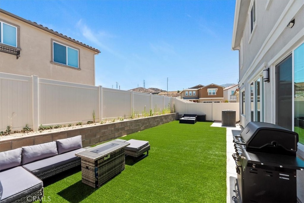 20911 Jennings Way Newhall, CA 91321 - Photo 50 of 50 a backyard of a house with table and chairs