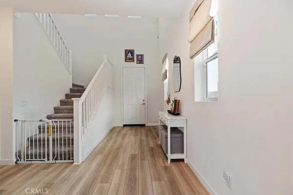 a view of entryway with wooden floor