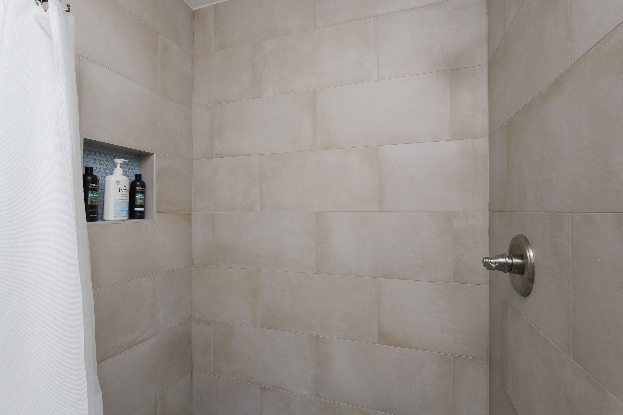 16 Ewing Street St. Augustine Beach, FL 32080 - Photo 13 of 55 a bathroom with a shower