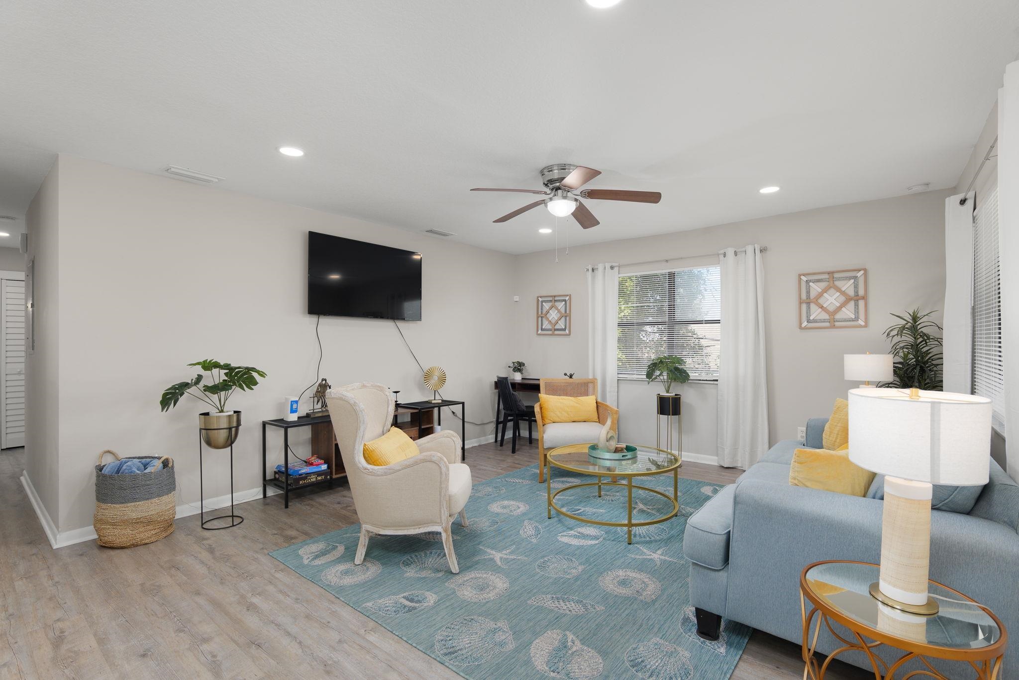 16 Ewing Street St. Augustine Beach, FL 32080 - Photo 23 of 55 a living room with furniture and a flat screen tv