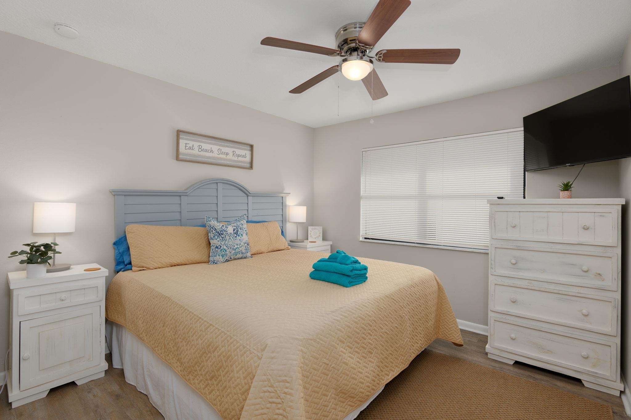 16 Ewing Street St. Augustine Beach, FL 32080 - Photo 25 of 55 a bedroom with a bed a dresser and a flat tv screen
