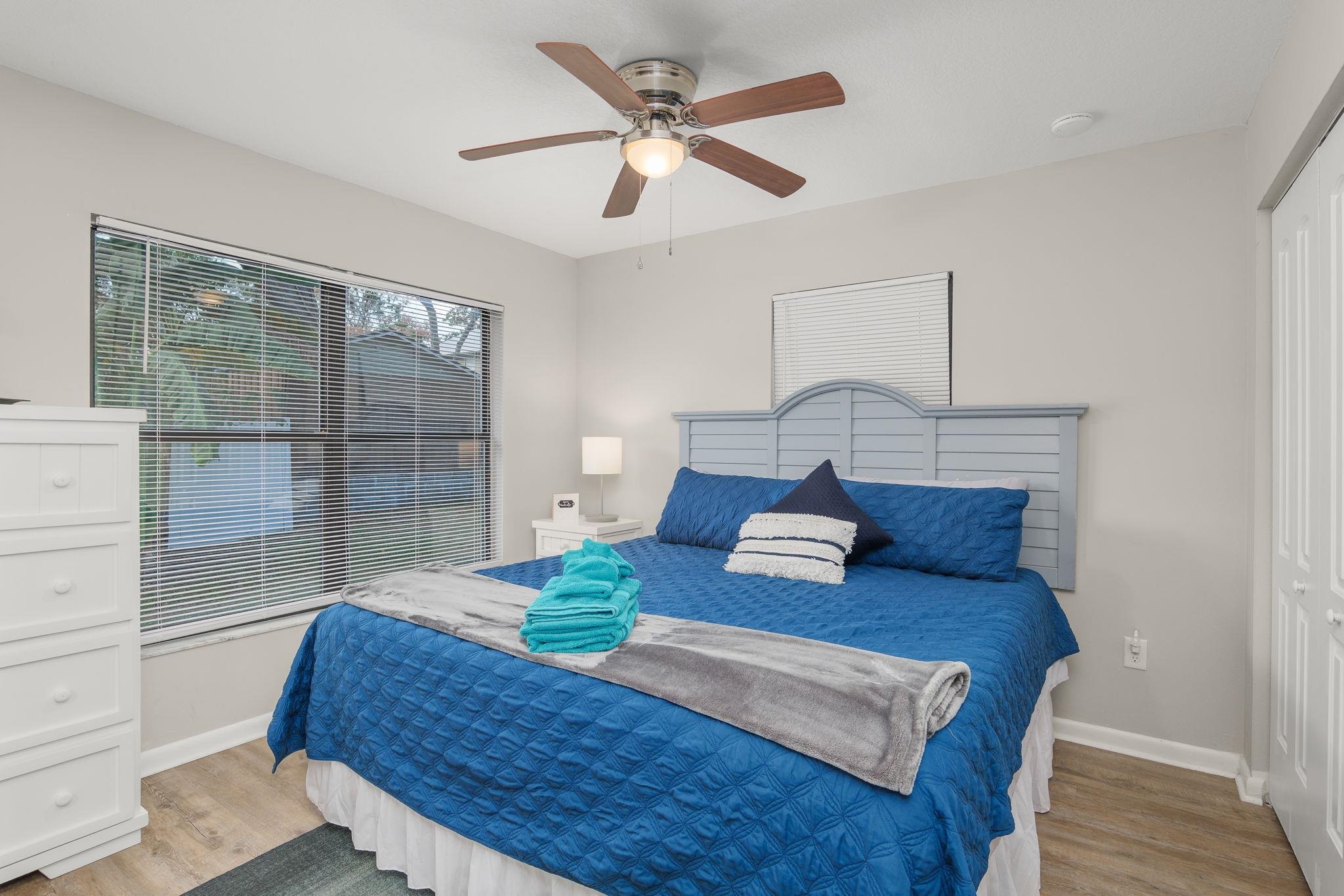 16 Ewing Street St. Augustine Beach, FL 32080 - Photo 30 of 55 a bedroom with a large bed and a glass window