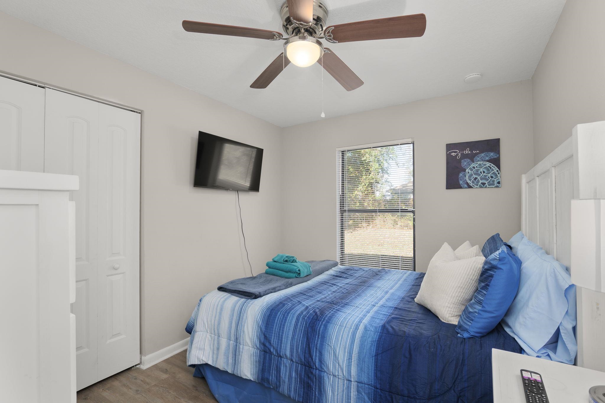 16 Ewing Street St. Augustine Beach, FL 32080 - Photo 33 of 55 a bedroom with a bed and a flat screen tv