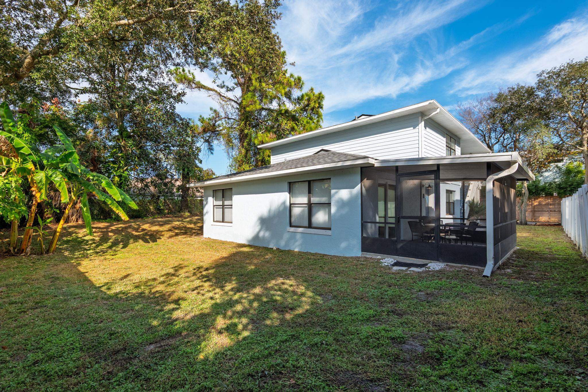 16 Ewing Street St. Augustine Beach, FL 32080 - Photo 35 of 55 a front view of a house with a garden