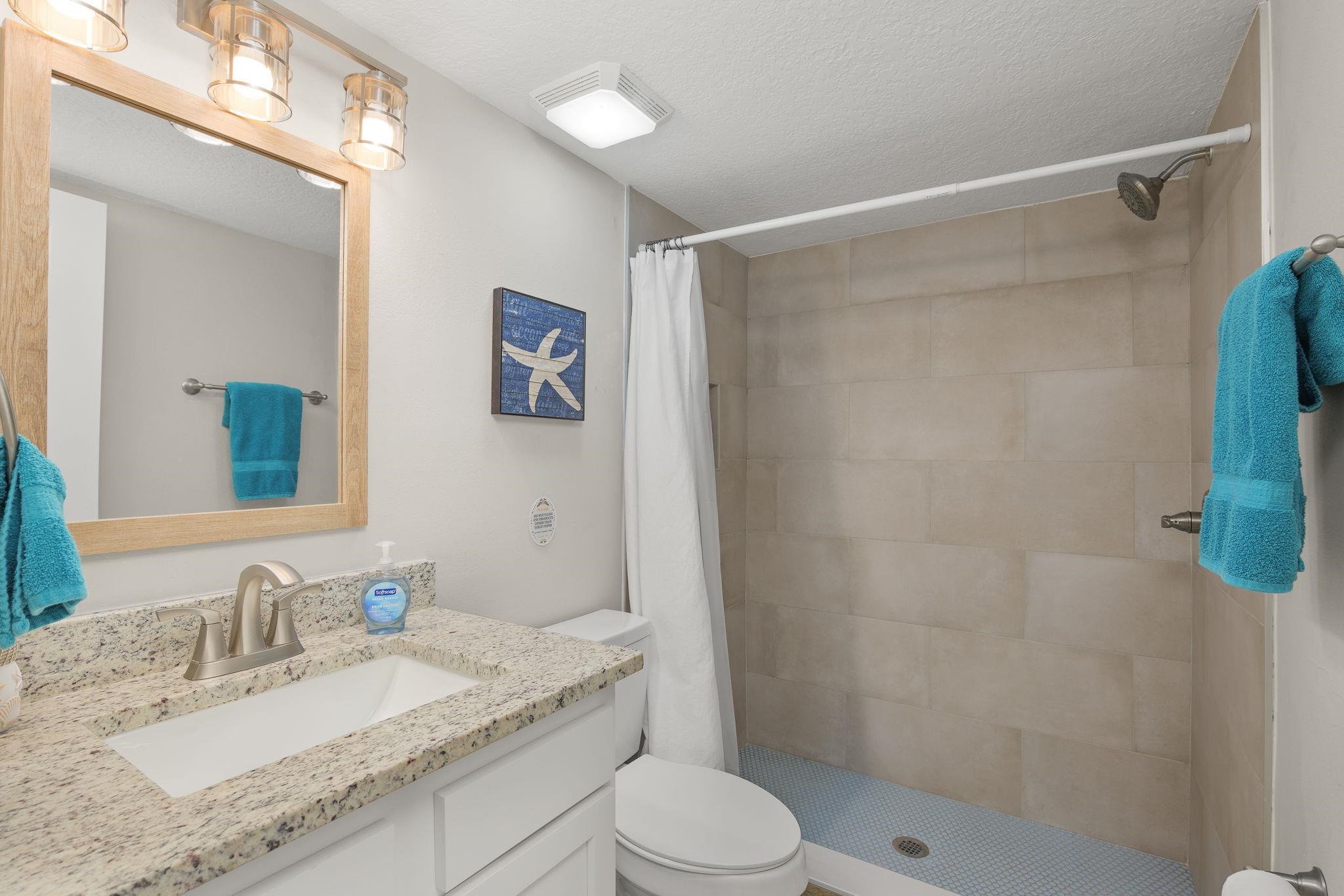 16 Ewing Street St. Augustine Beach, FL 32080 - Photo 40 of 55 a bathroom with a granite countertop sink toilet and shower