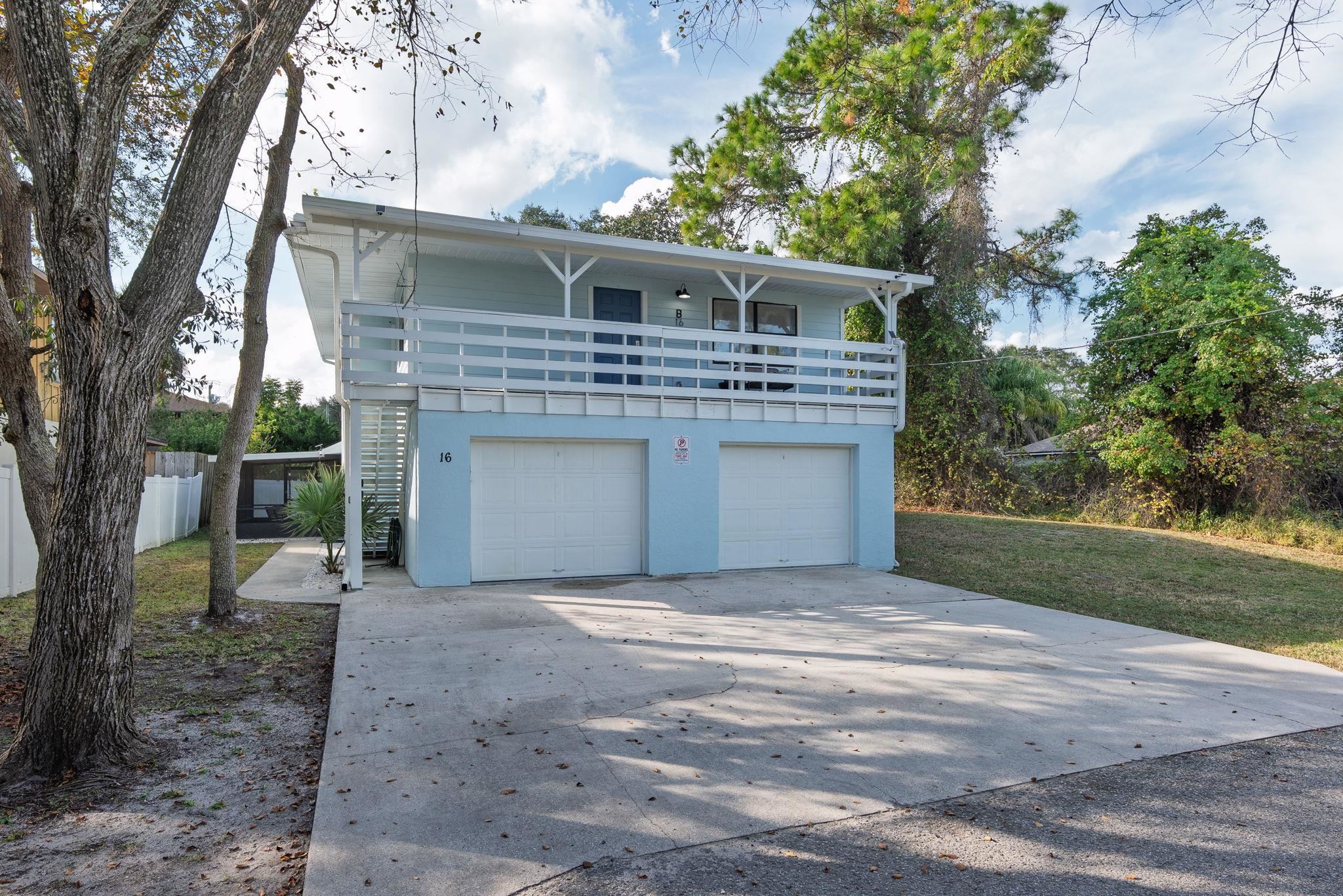 16 Ewing Street St. Augustine Beach, FL 32080 - Photo 4 of 55 a front view of a house with yard