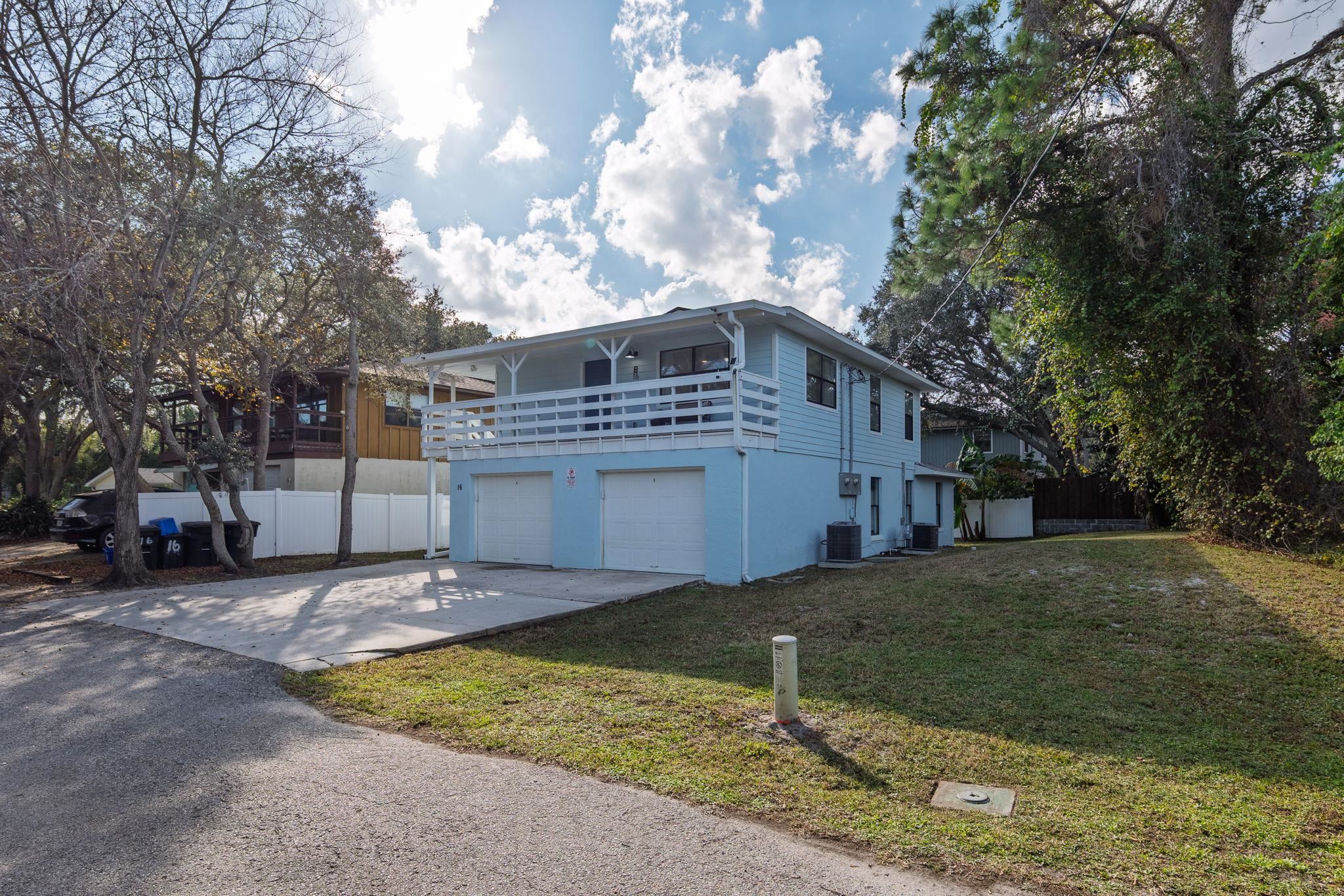 16 Ewing Street St. Augustine Beach, FL 32080 - Photo 50 of 55 a view of a house with a yard
