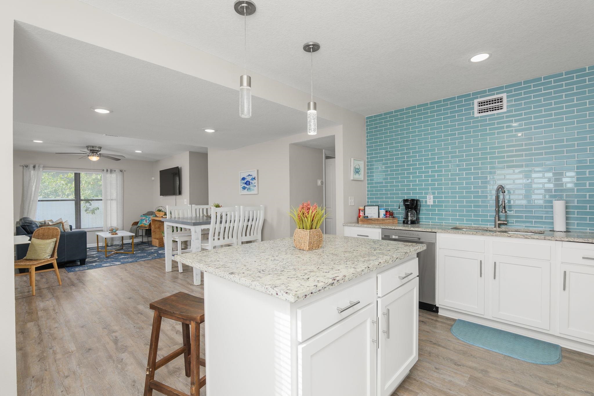 16 Ewing Street St. Augustine Beach, FL 32080 - Photo 7 of 55 a kitchen with center island table and chairs