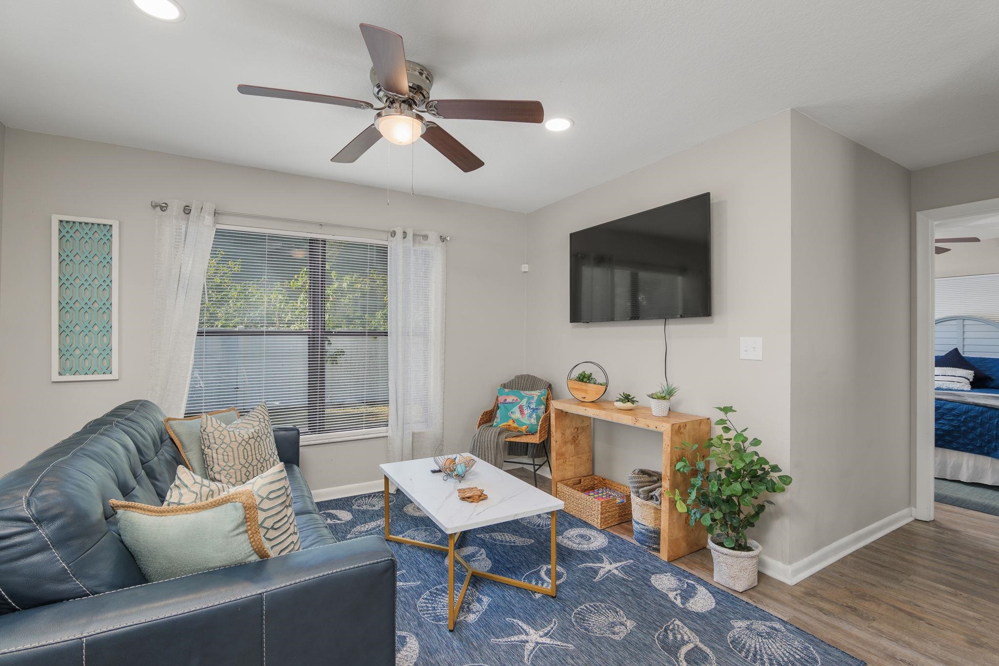 16 Ewing Street St. Augustine Beach, FL 32080 - Photo 9 of 55 a living room with furniture and a flat screen tv