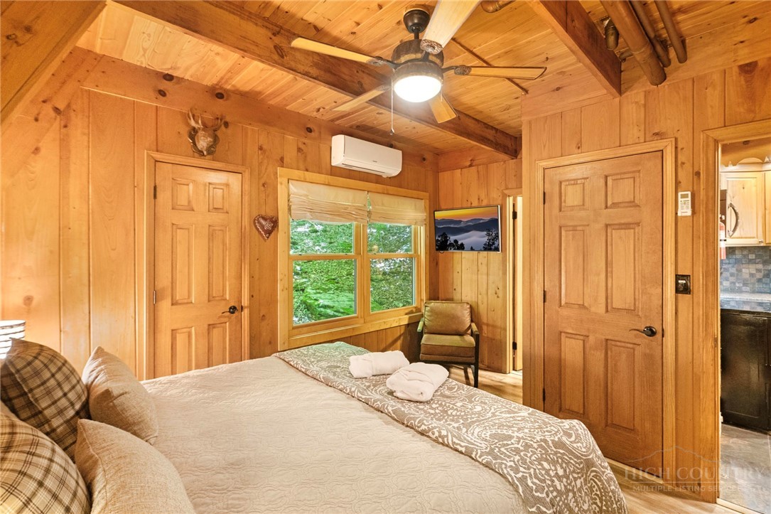 268 Cherry Drive Boone, NC 28607 - Photo 12 of 29 a bedroom with a bed and a window