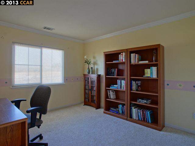 Terraced Hills Way San Ramon, CA 94583 - Photo 12 of 15 a view of a workspace with furniture and a bookshelf