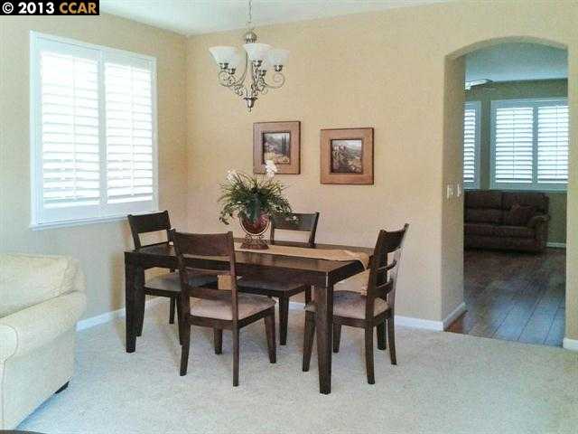Terraced Hills Way San Ramon, CA 94583 - Photo 3 of 15 a view of a dining room with furniture and wooden floor