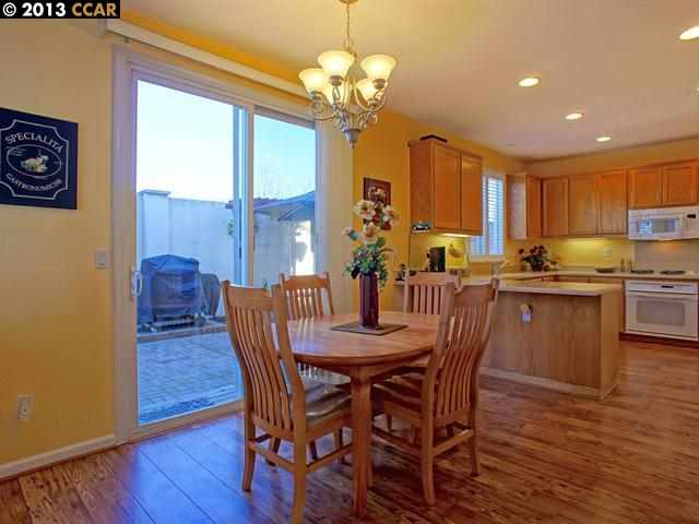 Terraced Hills Way San Ramon, CA 94583 - Photo 5 of 15 a view of a dining room with furniture a chandelier and wooden floor