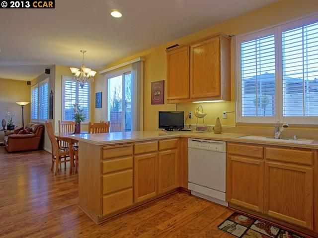 Terraced Hills Way San Ramon, CA 94583 - Photo 6 of 15 a kitchen with sink cabinets and wooden floor
