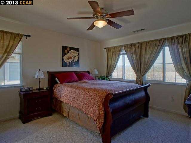 Terraced Hills Way San Ramon, CA 94583 - Photo 7 of 15 a bed sitting in a room next to a window
