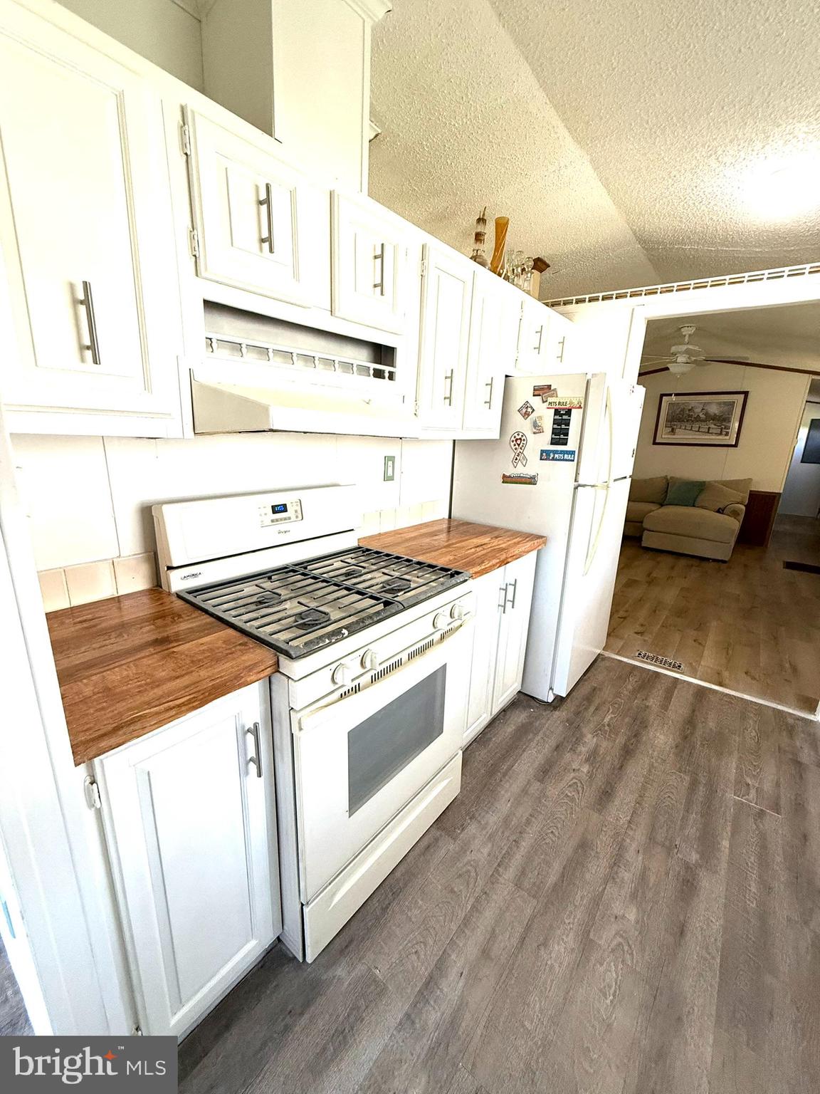 2908 Ram Road Cambridge, MD 21613 - Photo 16 of 27 a kitchen with granite countertop a stove and a sink