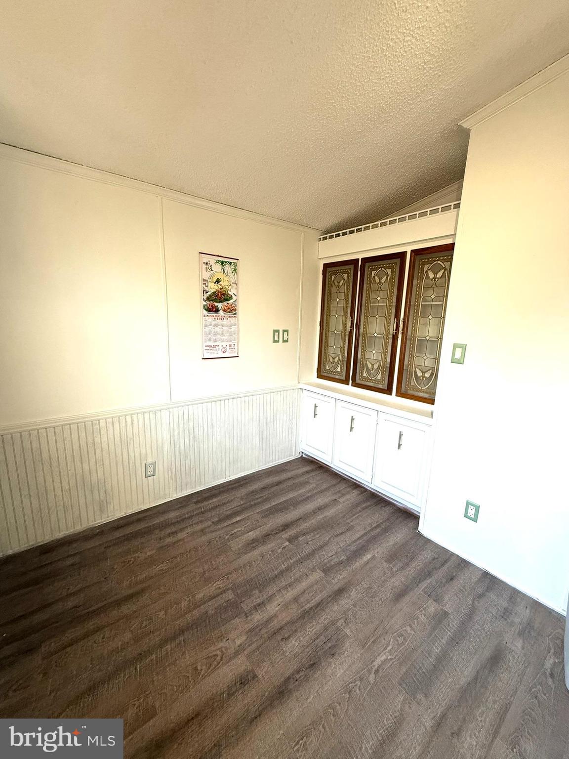 2908 Ram Road Cambridge, MD 21613 - Photo 20 of 27 a view of an empty room with wooden floor and a window