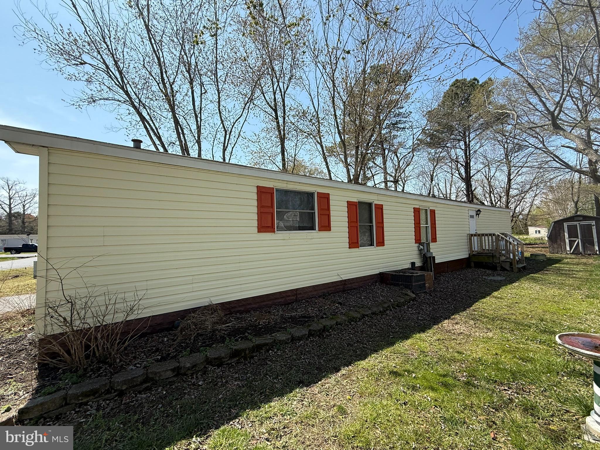 2908 Ram Road Cambridge, MD 21613 - Photo 8 of 27 a side view of a house with a yard