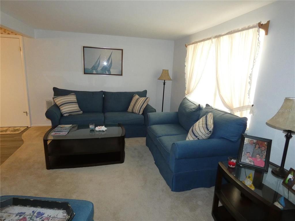 4392 Craftsbury Drive New Port Richey, FL 34652 - Photo 16 of 41 a living room with furniture and a large window